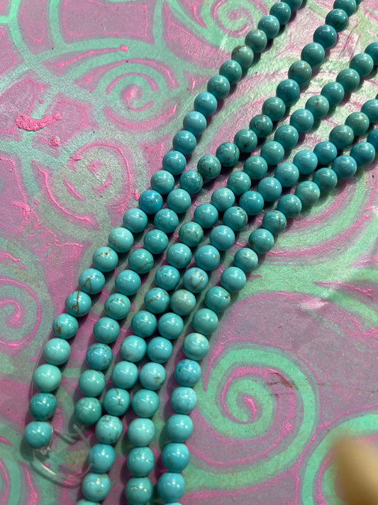 MAGNESITE 6MM ROUND MEDIUM TURQUOISE COLO 1 STRAND