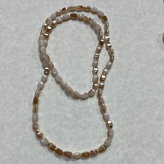 GLASS TEARDROP 9X6MM FACETED NAVAJO WHITE GOLD