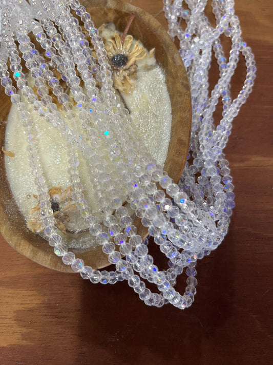 GLASS RONDELLE 4MM CLEAR 1 STRAND