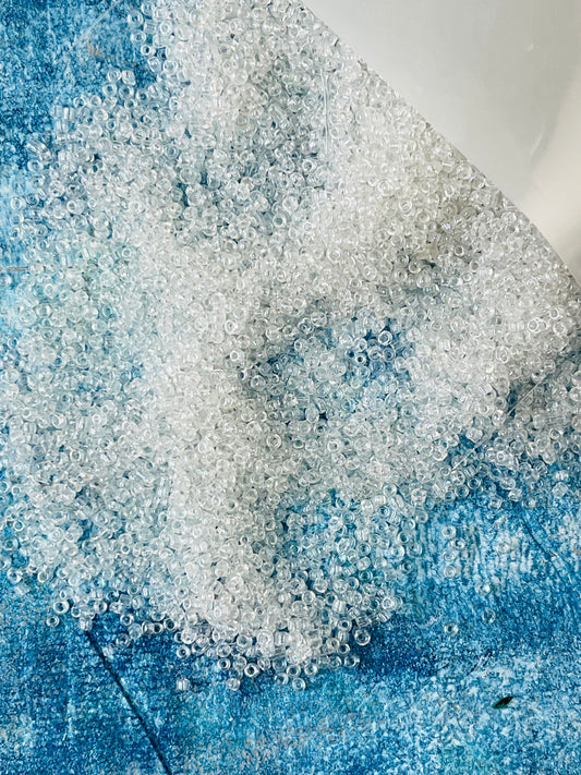 Seed bead 0.6mm transparent luster about 50 grams pack