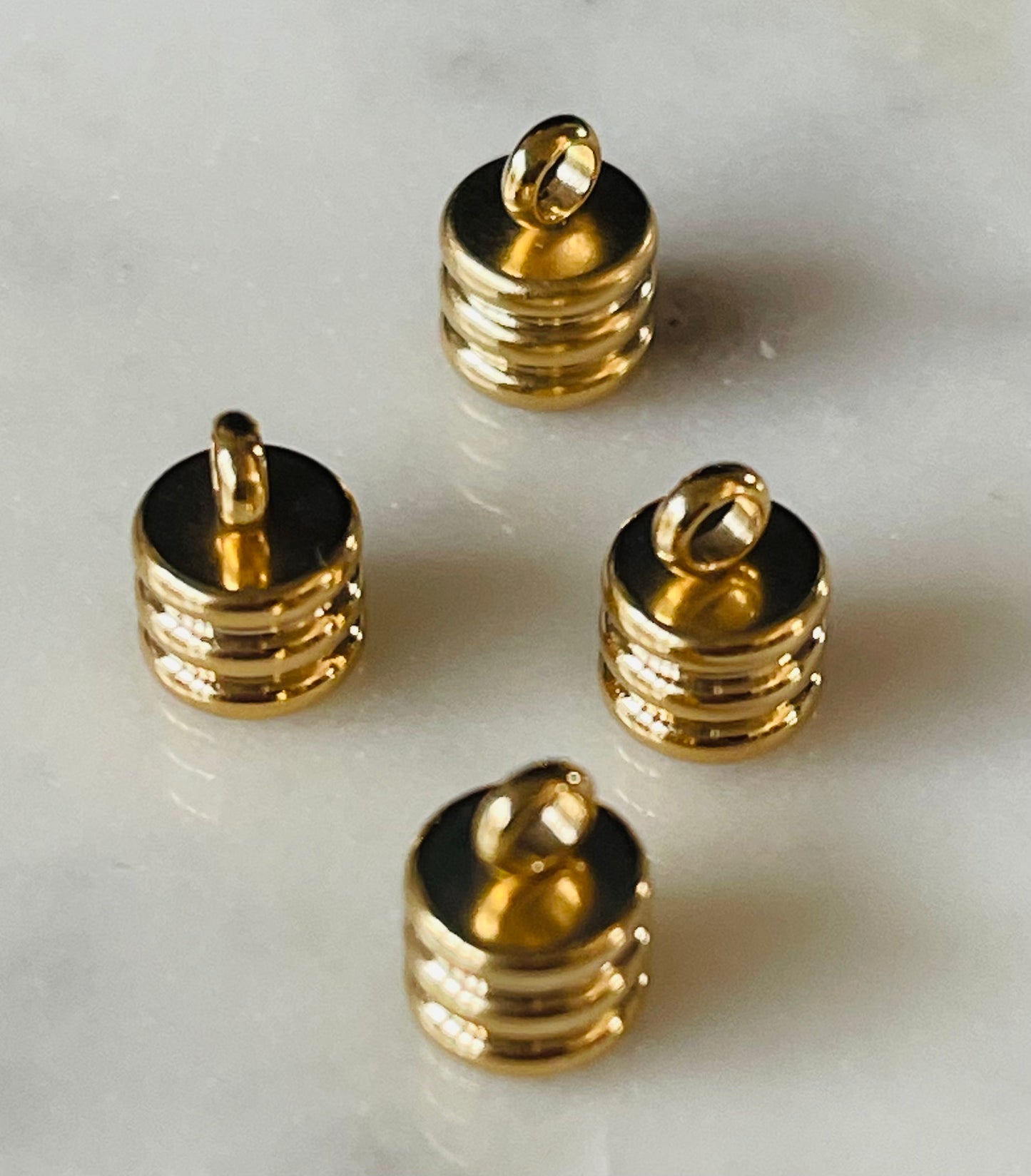 CORD END GP 9X7MM HOLE 2.5MM 4 PC