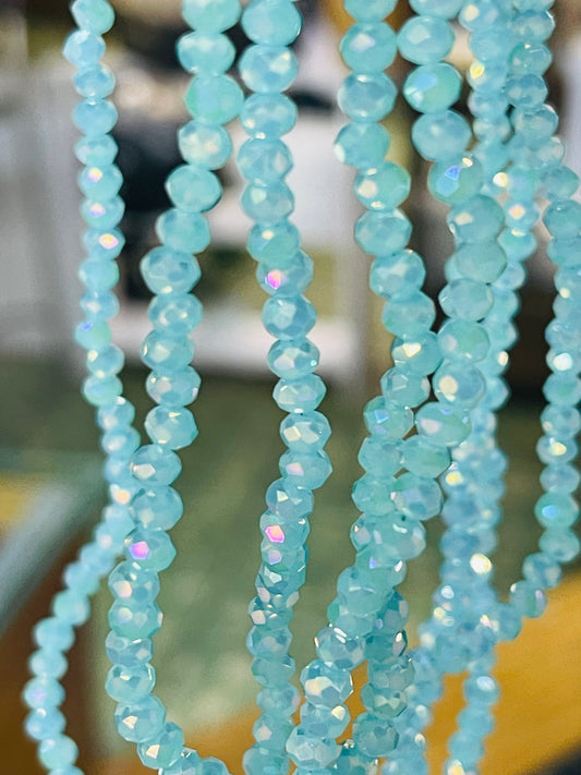 GLASS RONDELLE 4X3MM dark aqua AB 1 strand