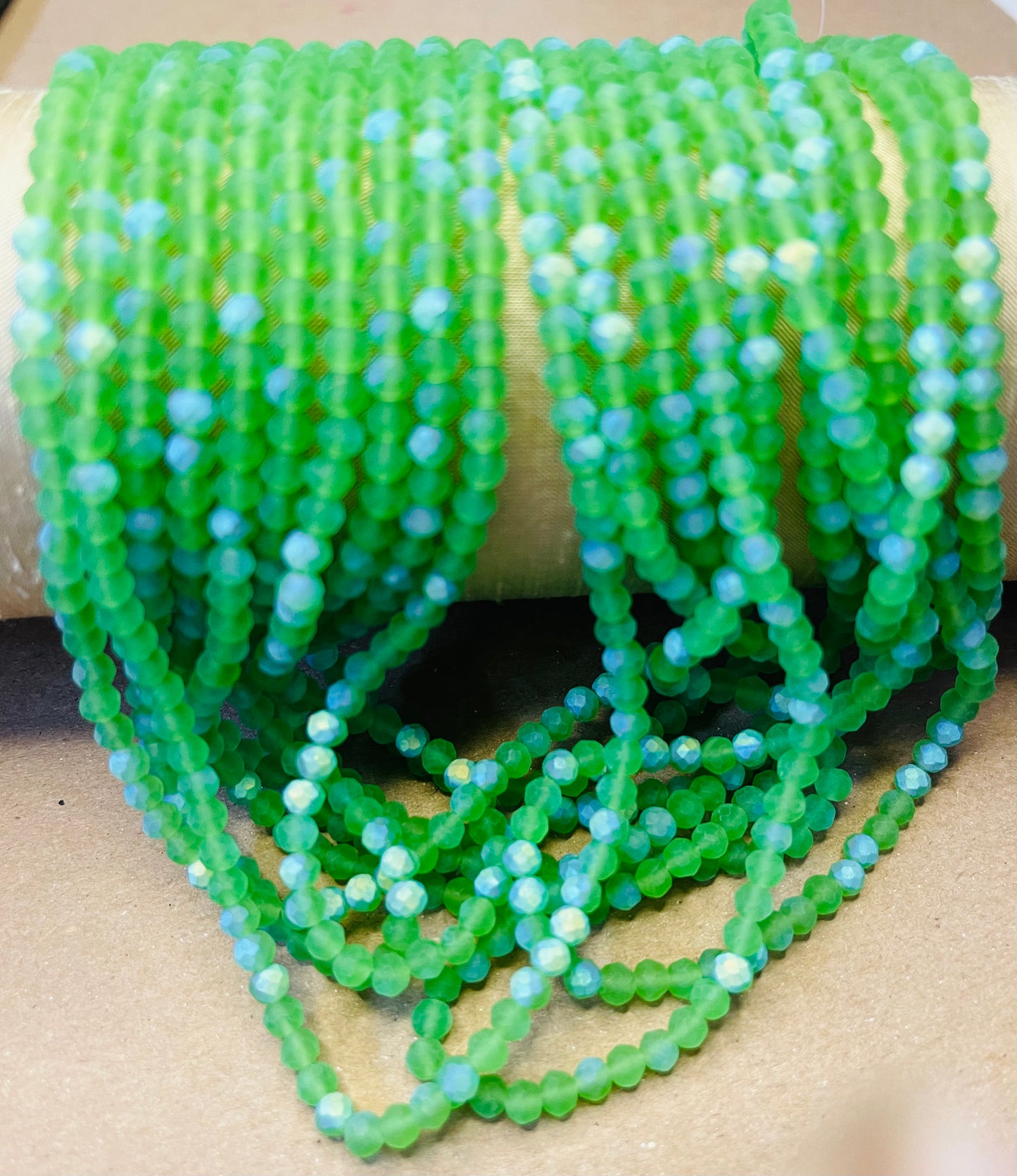 GLASS RONDELLE 4MM HALF AB FACETED AND FROSTED 1 STRAND 117 PCS
