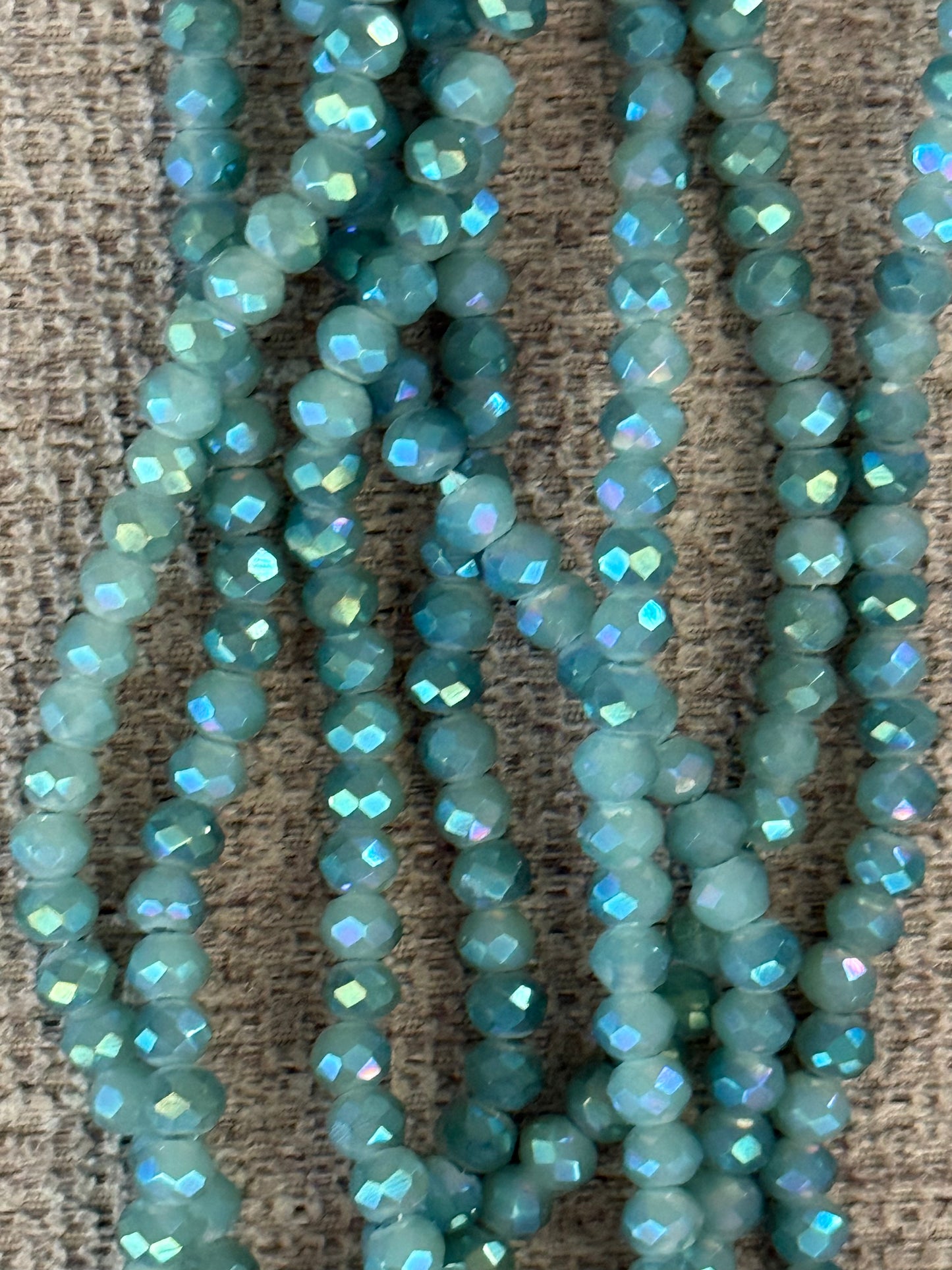 GLASS RONDELLE 4X3MM SAGE GREEN AB 1 STRAND
