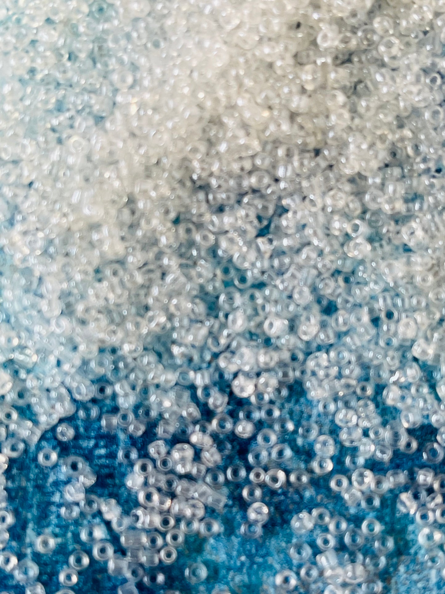 Seed bead 0.6mm transparent luster about 50 grams pack