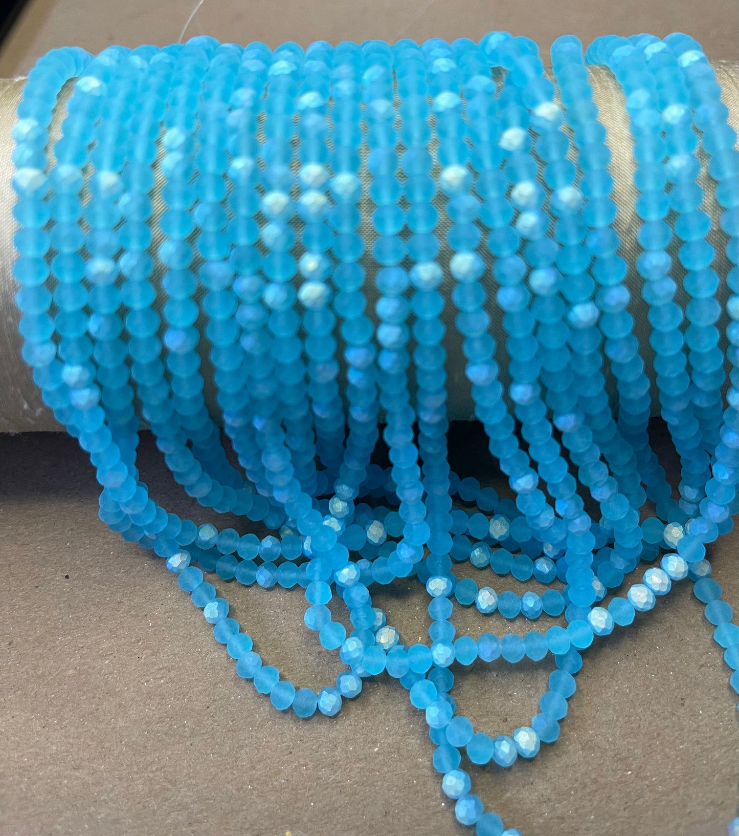 GLASS RONDELLE 4MM HALF AB FACETED AND FROSTED 1 STRAND 117 PCS