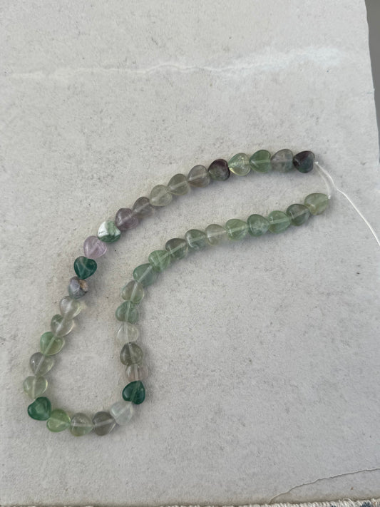 FLUORITE HEART 10X10MM 1 STRAND