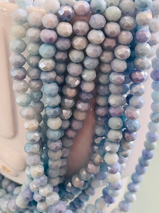 GLASS RONDELLE 6X5MM LIGHT BLUE 88 PS PER STRAND