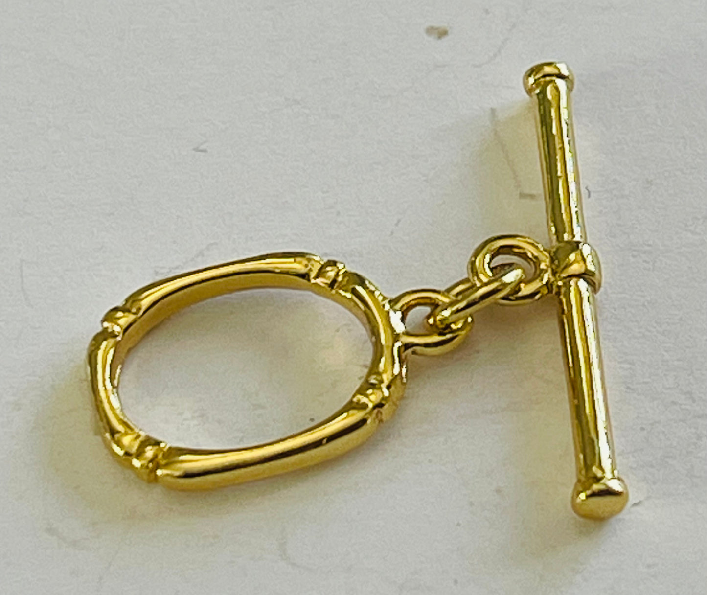 TOGGLE 16x11 mm Oval gold plate 18 kt 1 set