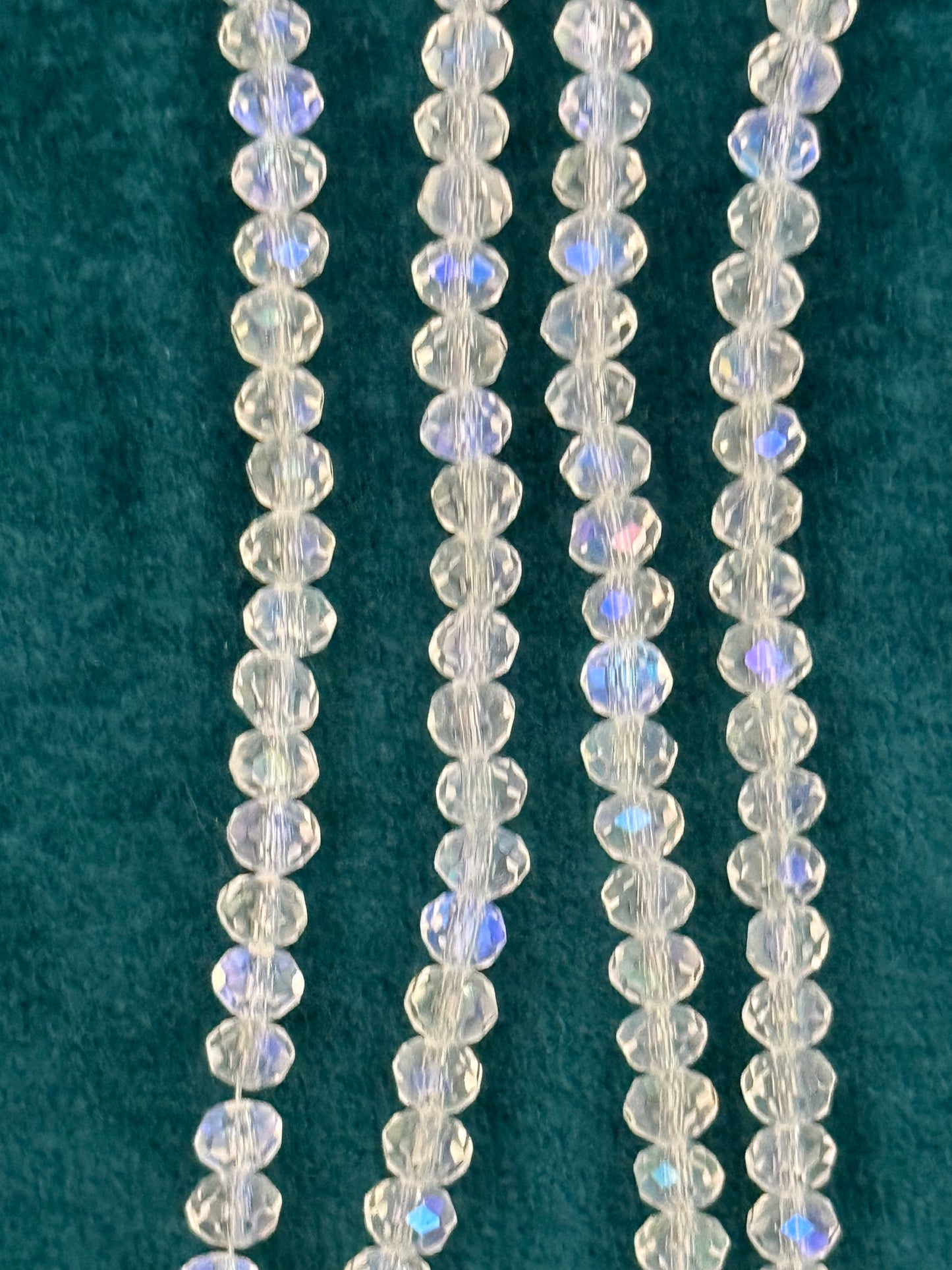 GLASS RONDELLE 4X3MM CLEAR AB 1 STRAND