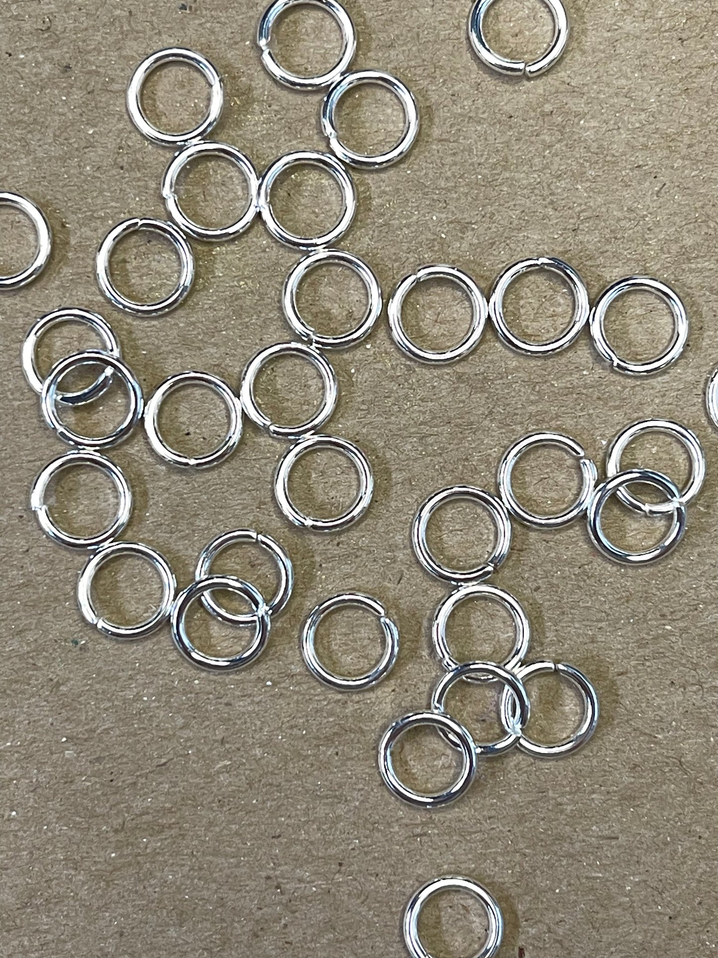JUMPRING 8MM SST SILVER PLATE 50 PC