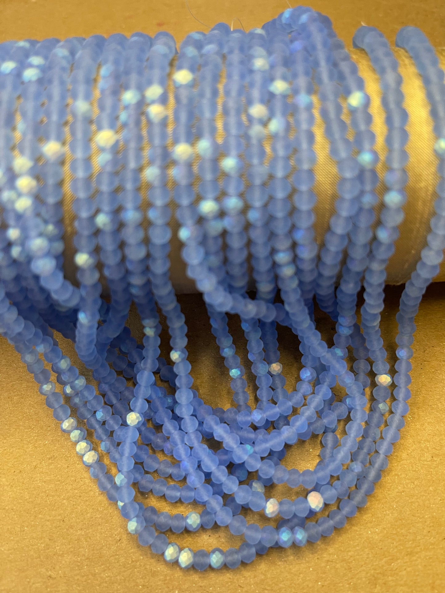 GLASS RONDELLE 4MM HALF AB FACETED AND FROSTED 1 STRAND 117 PCS