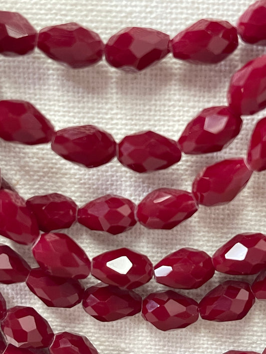 GLASS TEARDROP 11X7MM DARK RED FACETED 56 PCS PER STRAND