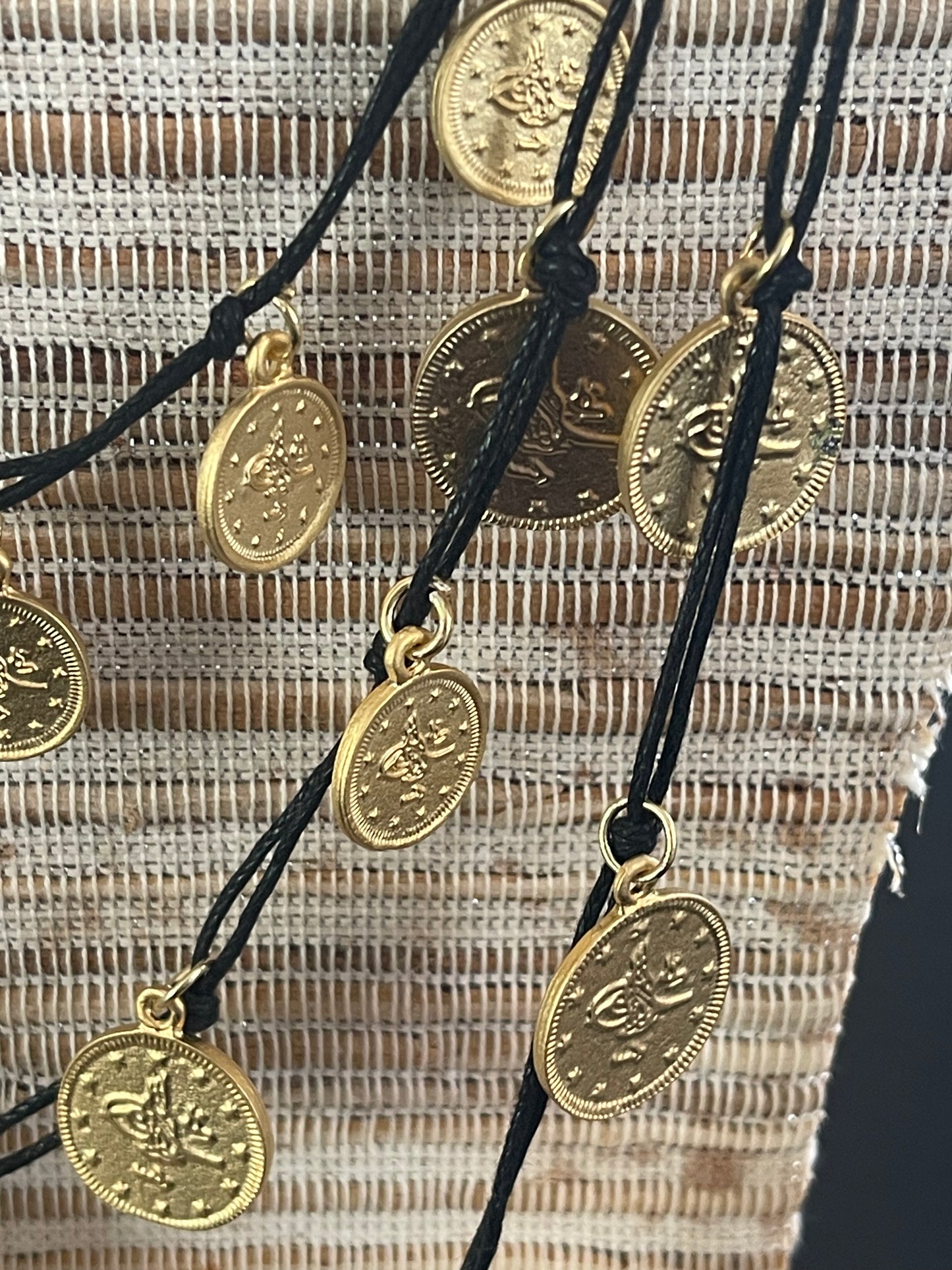 NECKLACE MATTE GOLD COINS BLACK CORD