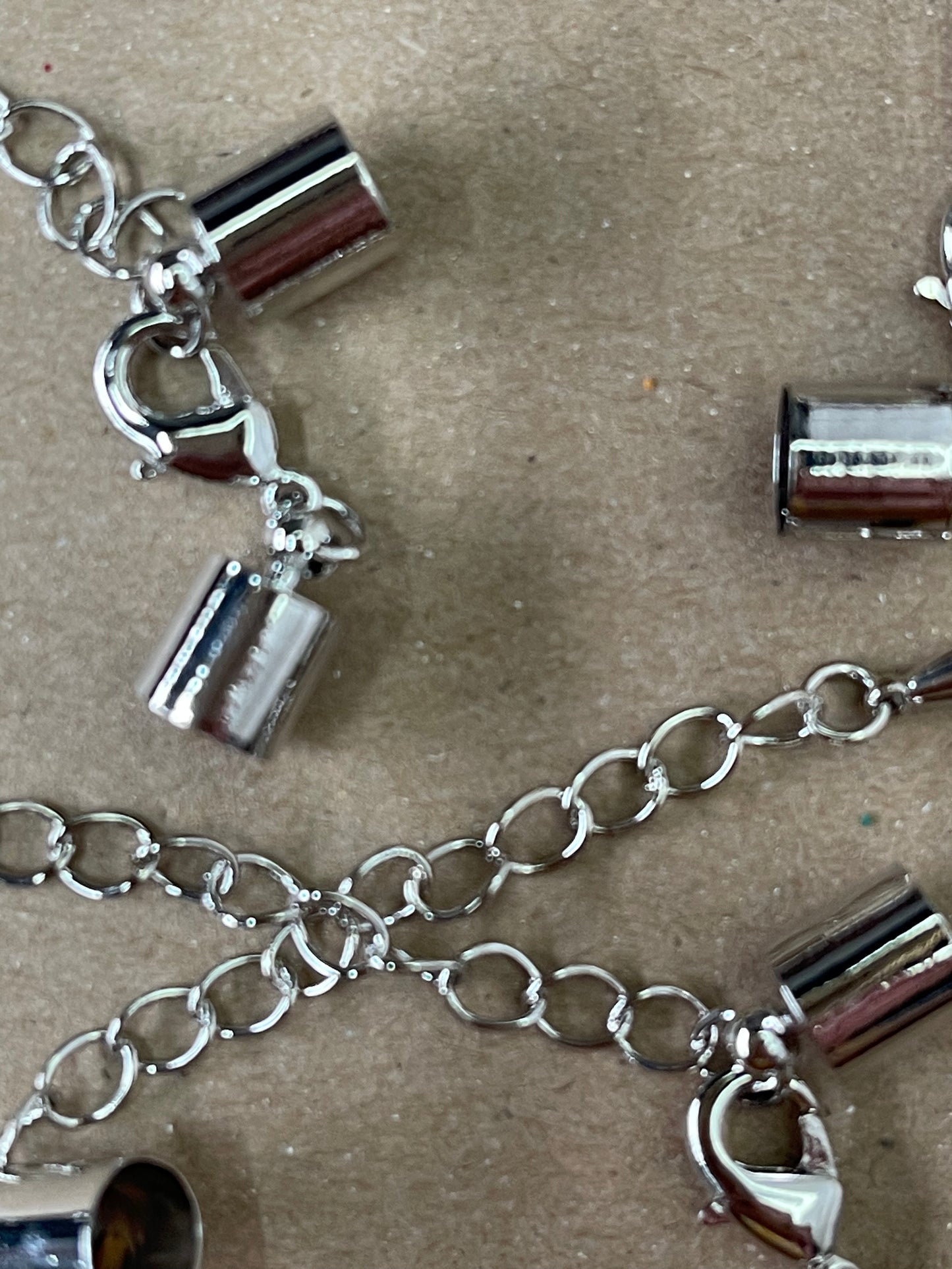 CORD END 11X7MM PLATINUM WITH CHAIN EXTENDER 5 SETS