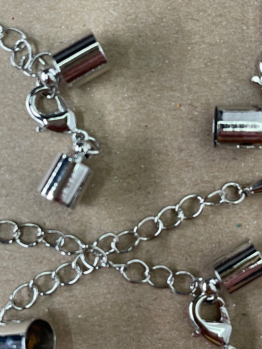 CORD END 11X7MM PLATINUM WITH CHAIN EXTENDER 5 SETS