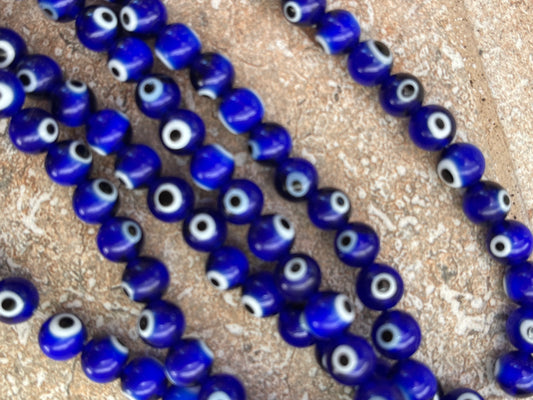 GLASS TURKISH EYE 8MM BLUE AND WHITE 1 STRAND