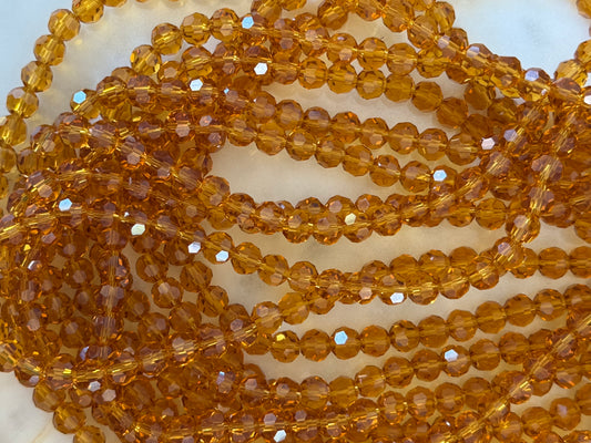 GLASS 6MM ROUND GOLDEN ROD 1 STRAND