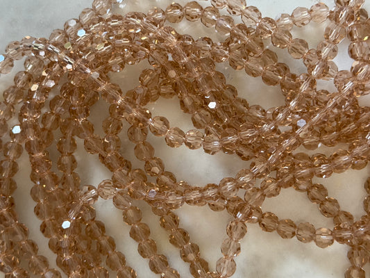 GLASS 6MM ROUND MOCCASIN 1 STRAND