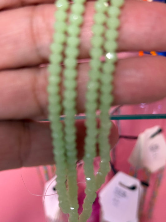 GLASS RONDELLE 4X3MM LIGHT GREEN 1 STRAND