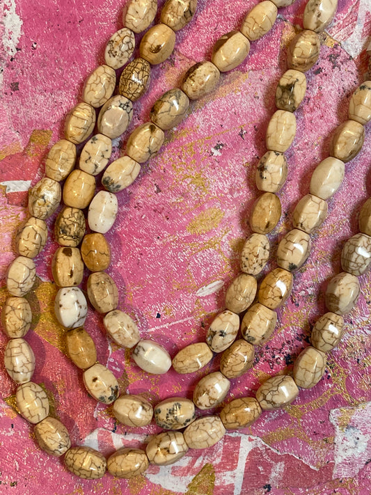 MAGNESITE 12X9 OVAL CREAM 34PCS 1 STRAND