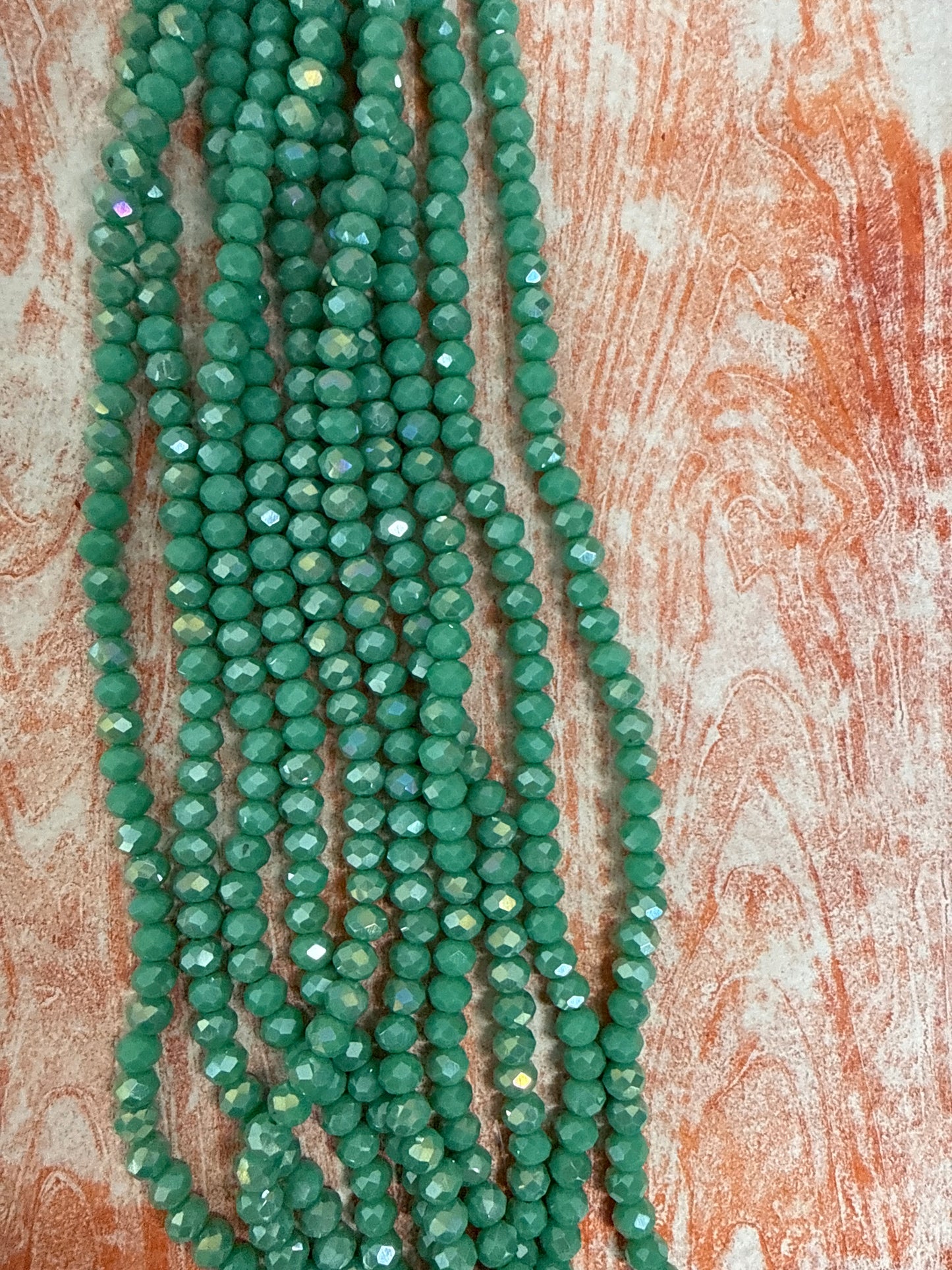 GLASS RONDELLE 6MM LIGHT SEA GREEN AB 1 STRAND