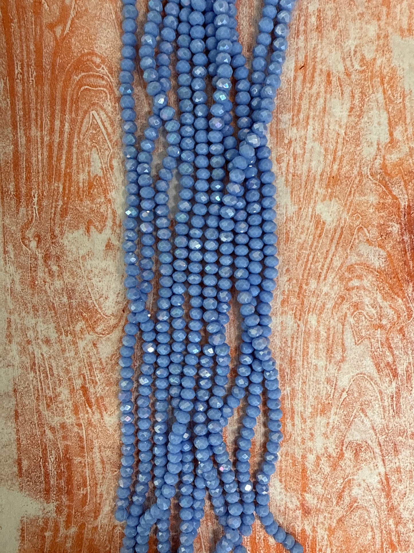 GLASS RONDELLE 6MM CORNFLOWER BLUE OPAQUE AB 1 STRAND