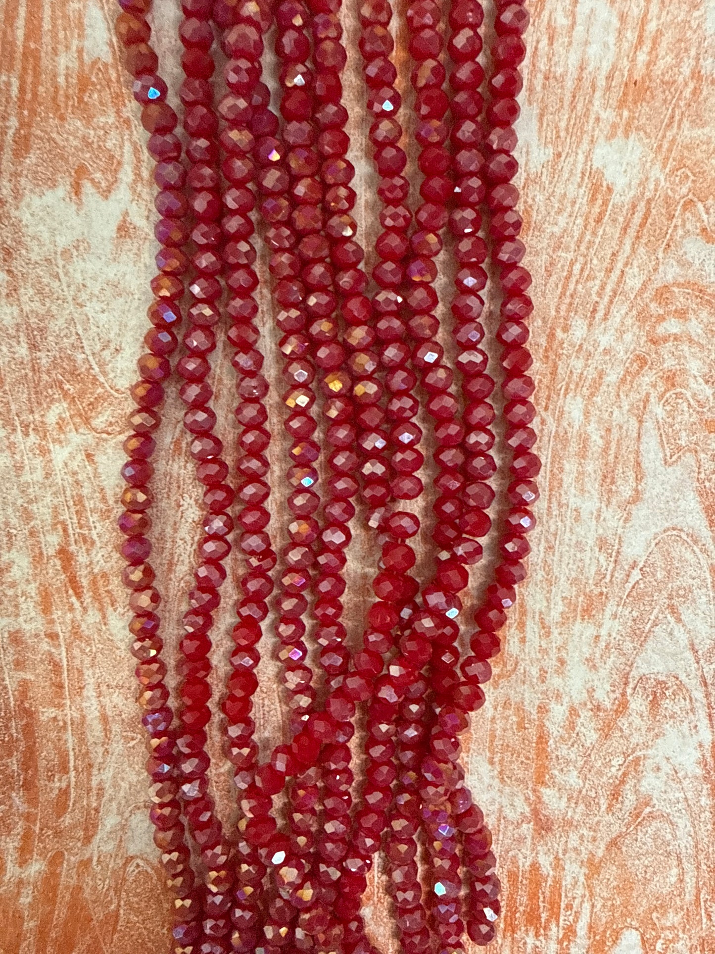 GLASS RONDELLE 6MM CRIMSON OPAQUE AB 1 STRAND