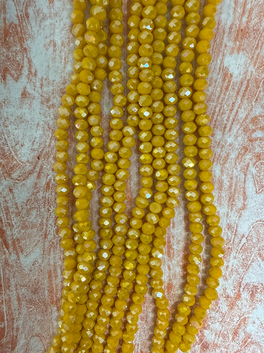 GLASS RONDELLE 6 MM GOLD OPAQUE AB 1 STRAND
