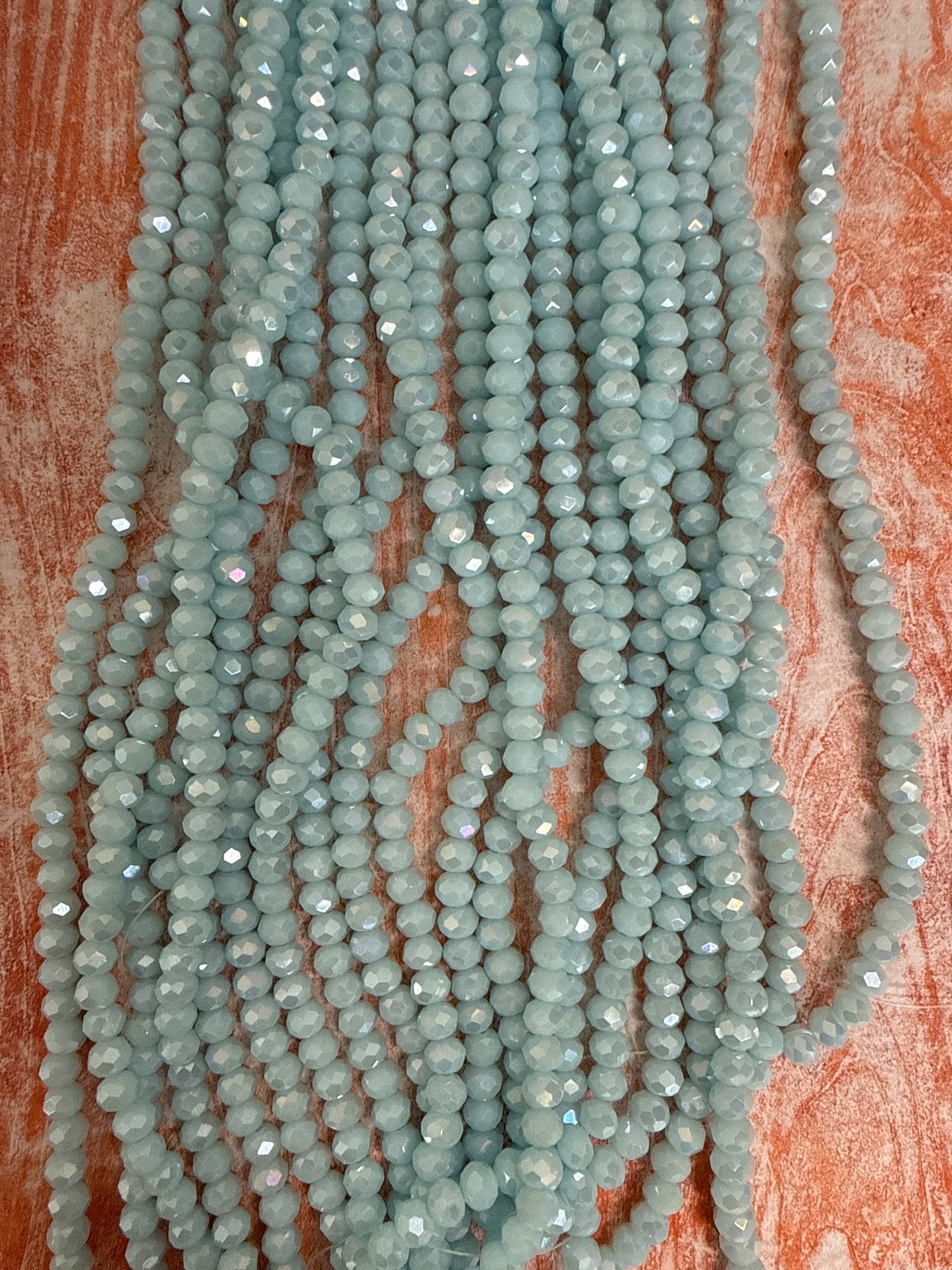GLASS RONDELLE 6MM AQUA OPAQUE AB 1 STRAND