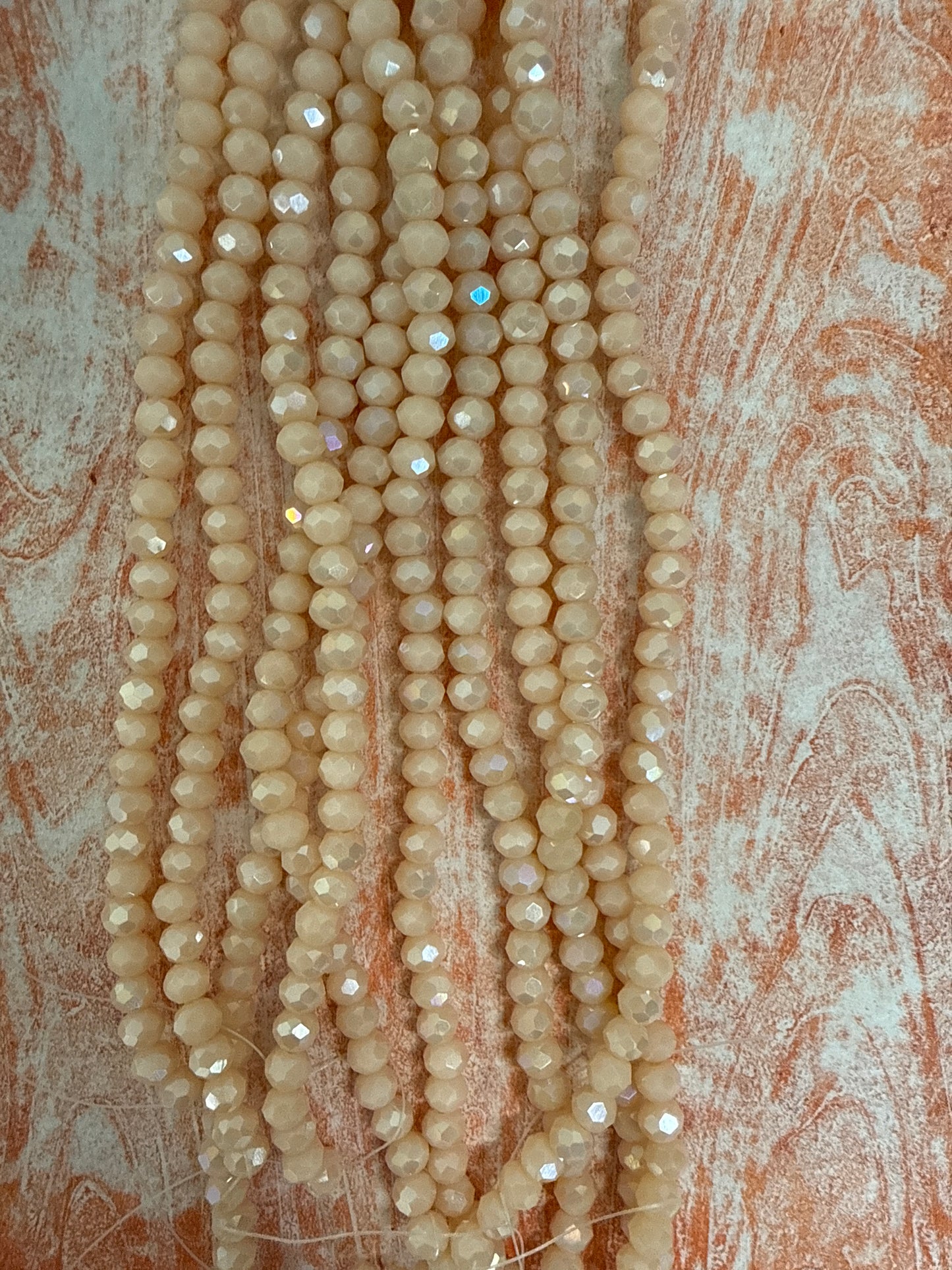 GLASS RONDELLE 6MM ANTIQUE WHITE OPAQUE AB 1 STRAND