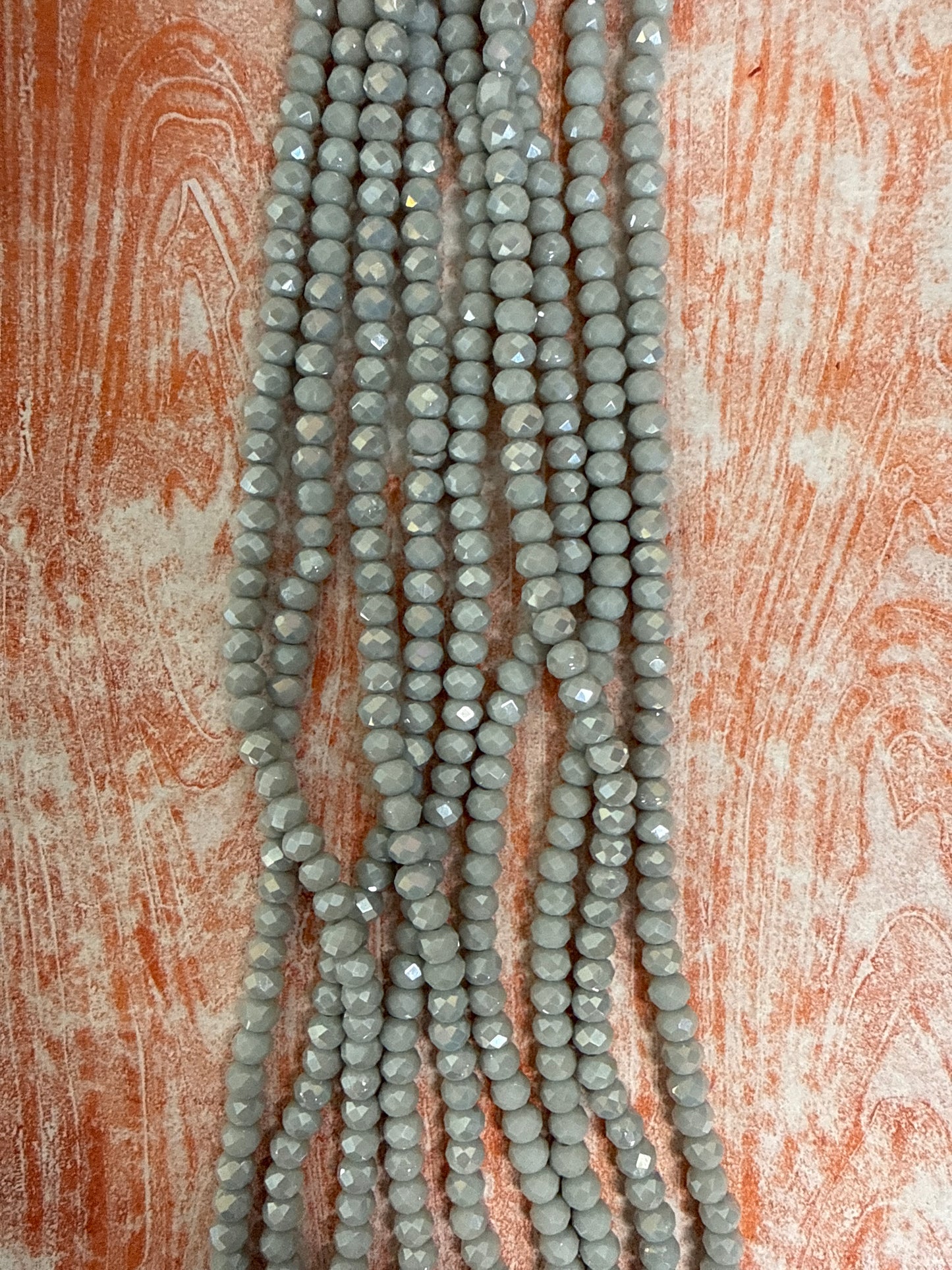 GLASS RONDELLE 6MM LIGHT GRAY OPAQUE AB 1 STRAND