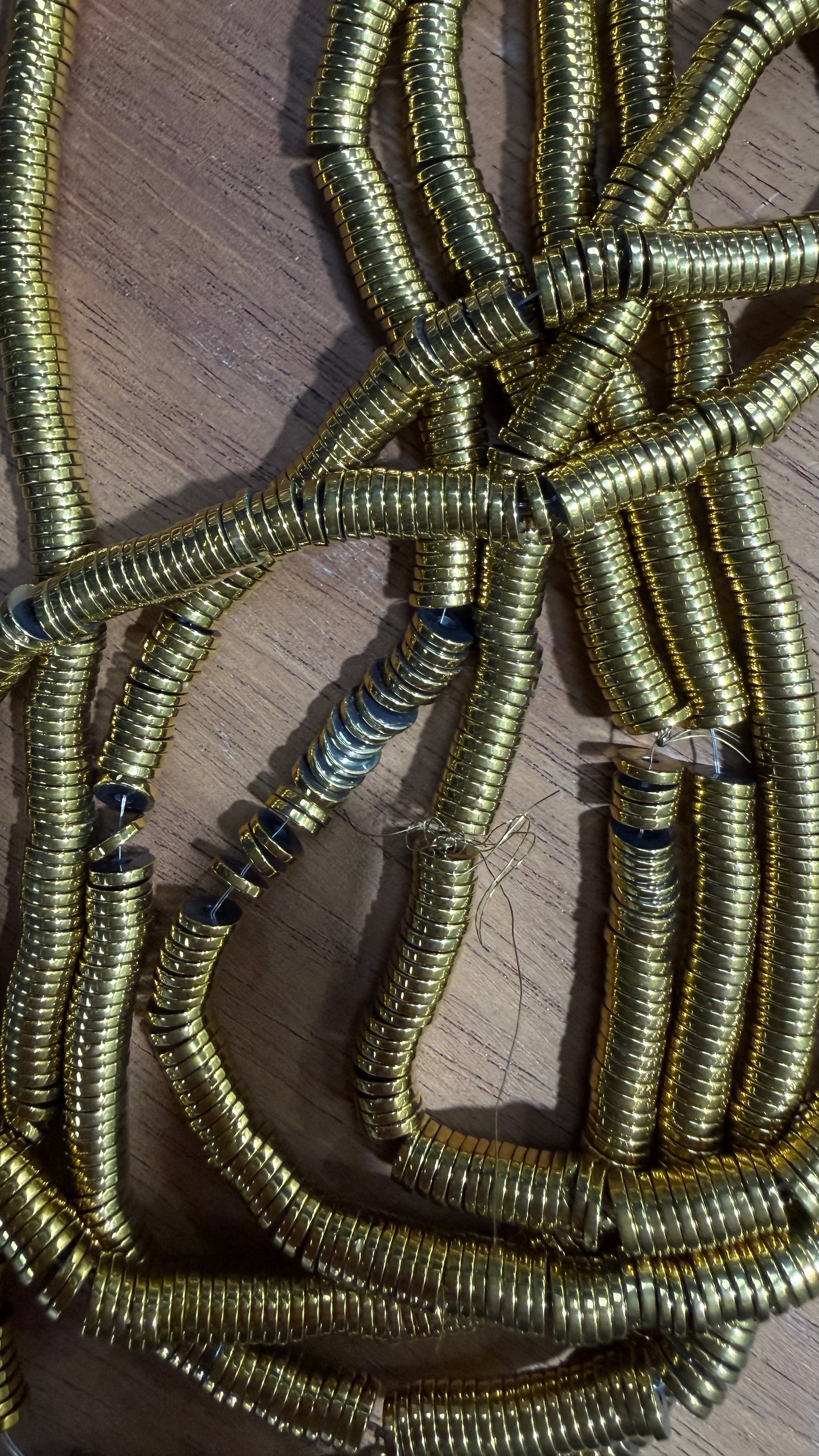 HEMATITE HEISHI BEAD   6X1 MM DRK GOLD 1 STRAND