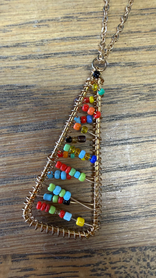 Necklace chain with triangle pendant with multicolor seed beads.