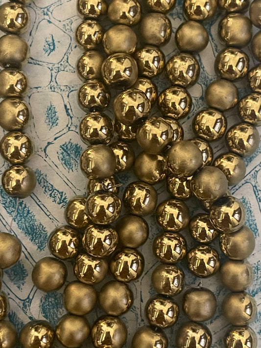 HEMATITE 8MM ROUND MATTE GOLD 1 STRAND