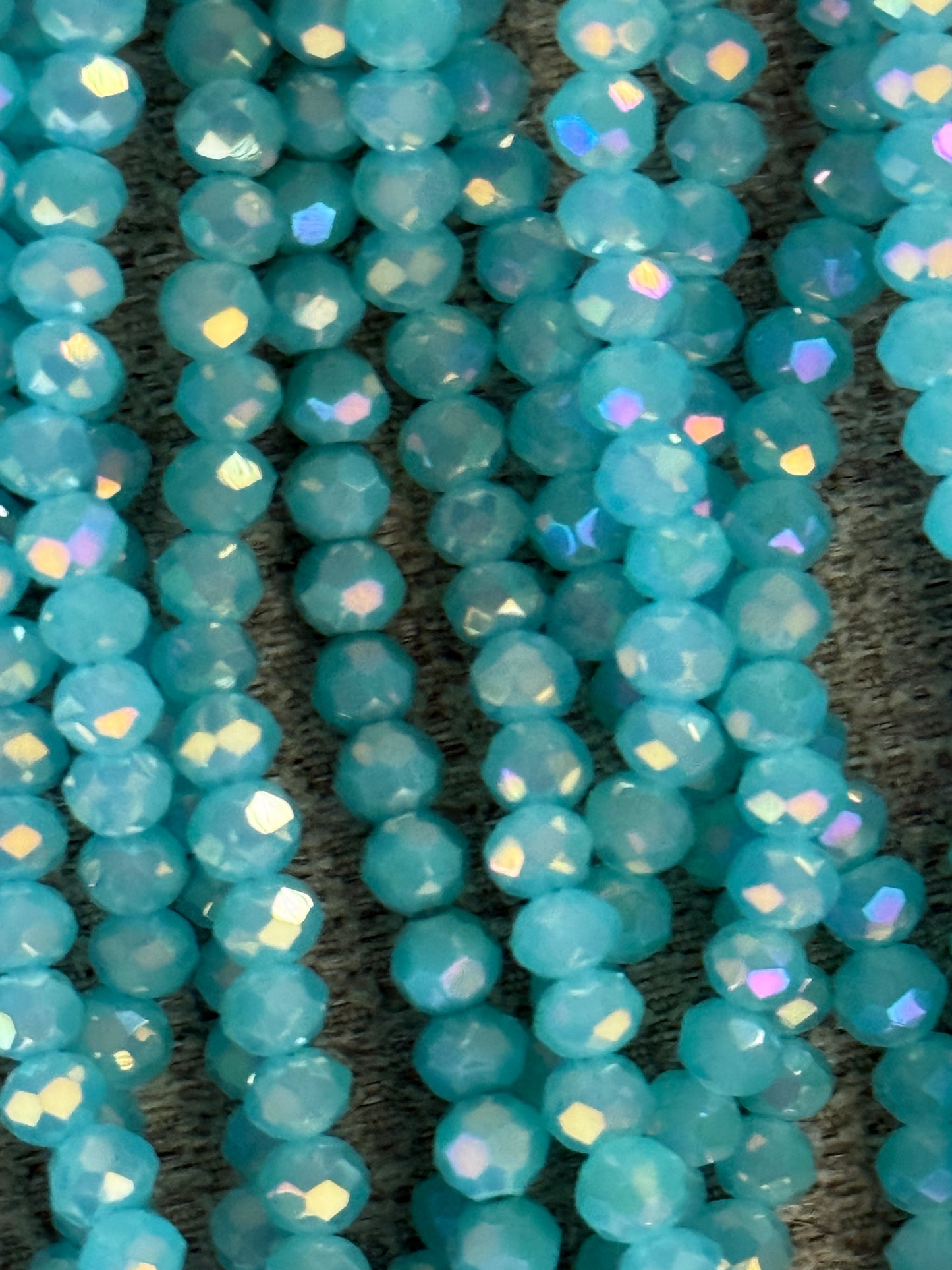GLASS RONDELLE4X3MM AQUA AB 1 STRAND