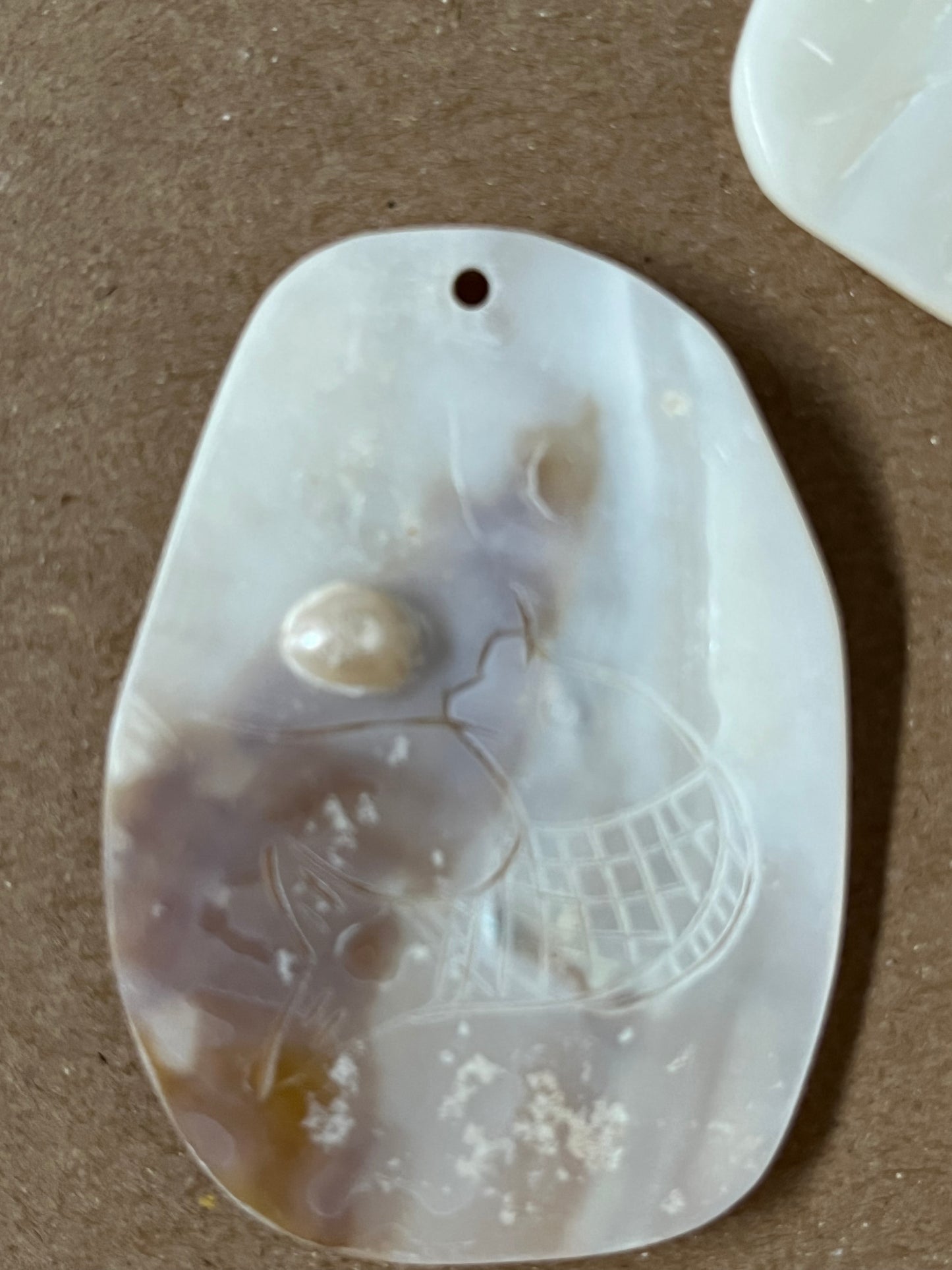 Pendant mother of pearl 47 mm with carved figures 2 pc