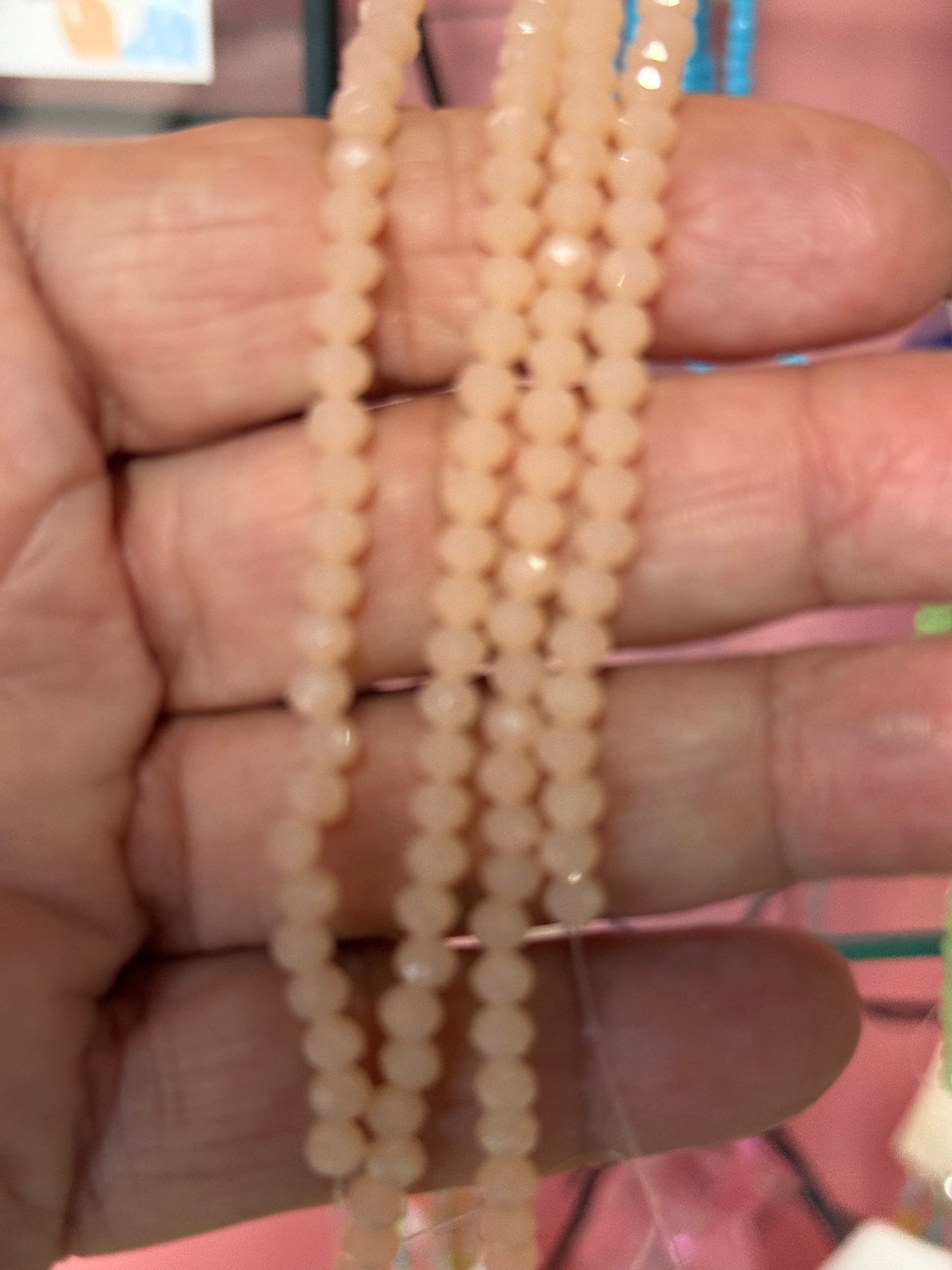 GLASS RONDELLE 4X3MM LIGHT CORAL 1 STRAND