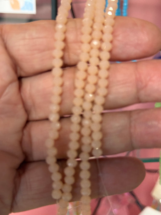 GLASS RONDELLE 4X3MM LIGHT CORAL 1 STRAND