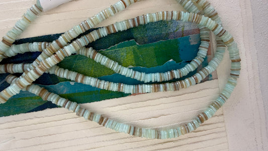 SHELL HEISHI 6MM LIGHT BLUE TAN ABOUT 190 BEADS PER 1 STRAND
