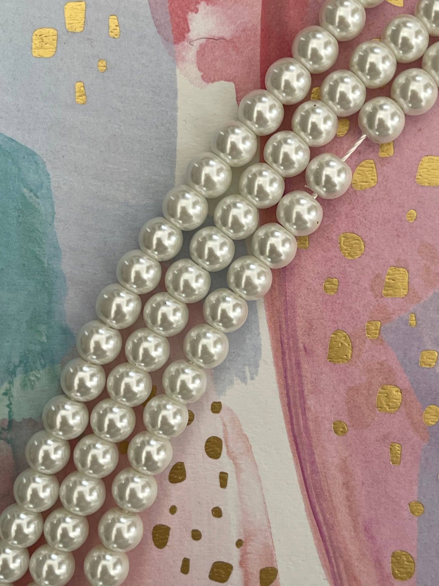 GLASS PEARL 6 MM WHITE ROUND 1 STRAND APROX 72 PCS