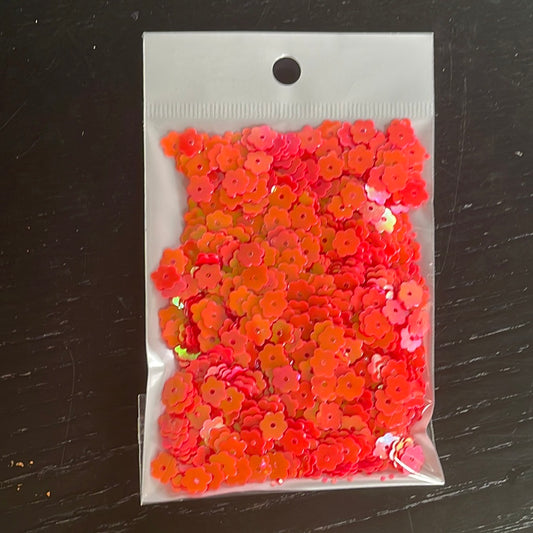 Filler para resina en acrílico. 15 gramoS. Flores anaranjadas 6 mm.