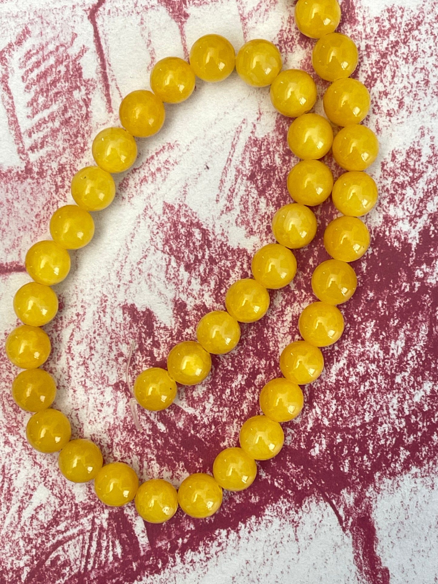 JADE 10MM ROUND YELLOW 1 STRAND